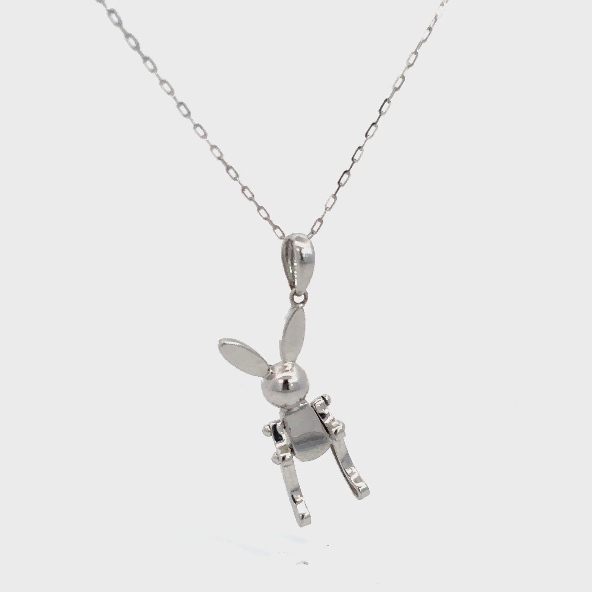 Collar con dije "conejo lego" con movimiento oro blanco 14k